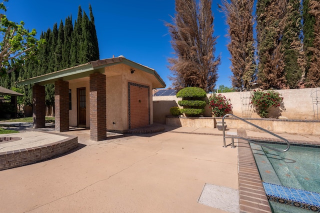 view of patio / terrace with a fenced in pool