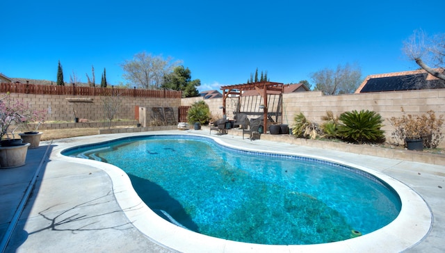 view of swimming pool featuring a patio, a fenced backyard, a fenced in pool, and a pergola