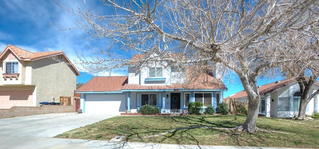 view of front of house with a porch, an attached garage, a tile roof, driveway, and a front yard