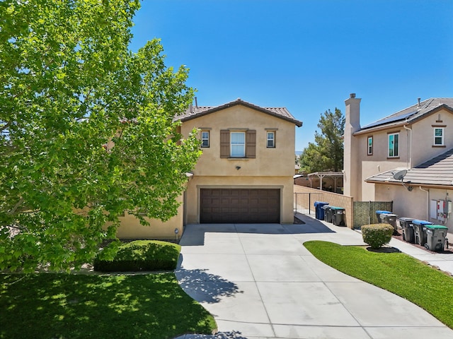 3024 Albret St, Lancaster, CA 93536 - view of front facade with stucco siding, an attached garage, concrete driveway, and fence