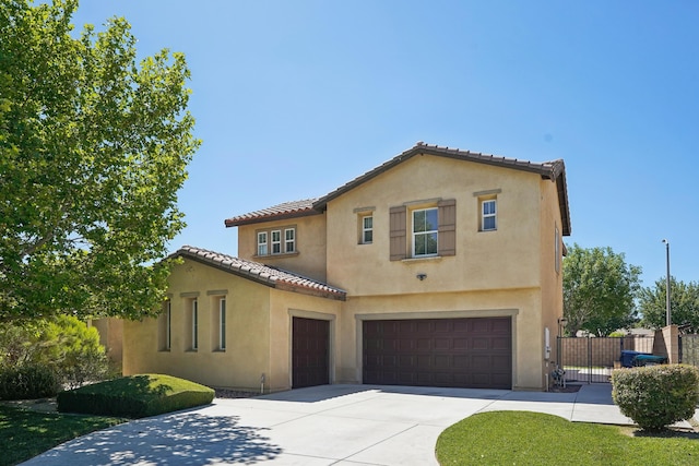 3024 Albret St, Lancaster, CA 93536 - mediterranean / spanish-style home featuring concrete driveway, stucco siding, an attached garage, fence, and a tiled roof