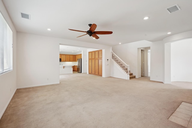 3024 Albret St, Lancaster, CA 93536 - unfurnished living room with stairway, recessed lighting, light carpet, a ceiling fan, and baseboards