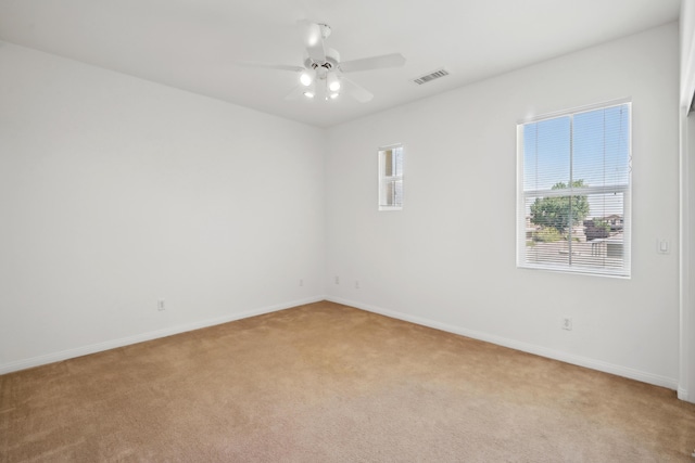 3024 Albret St, Lancaster, CA 93536 - empty room with light colored carpet, ceiling fan, and baseboards