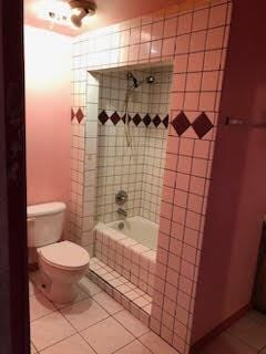 1132 Morven St, Lancaster, CA 93535 - full bathroom featuring tile patterned flooring, toilet, and tiled shower / bath combo
