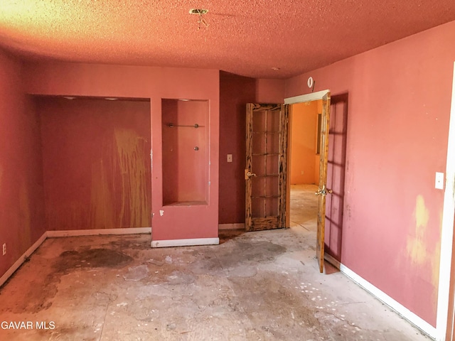 1132 Morven St, Lancaster, CA 93535 - unfurnished bedroom featuring a textured ceiling and baseboards