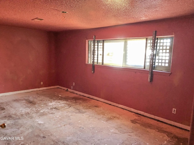 1132 Morven St, Lancaster, CA 93535 - unfurnished room with a textured ceiling and baseboards