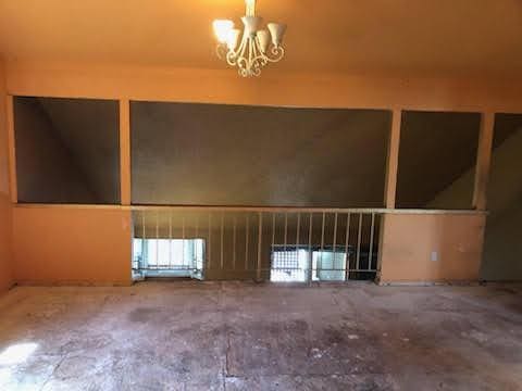 1132 Morven St, Lancaster, CA 93535 - spare room with a chandelier