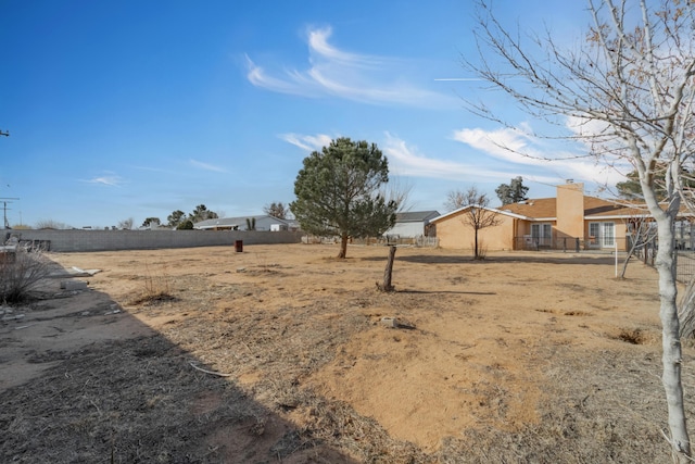 view of yard featuring fence