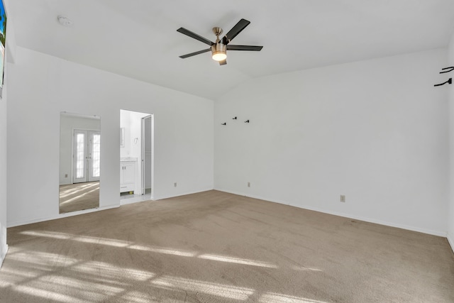 unfurnished room with lofted ceiling, ceiling fan, french doors, and carpet