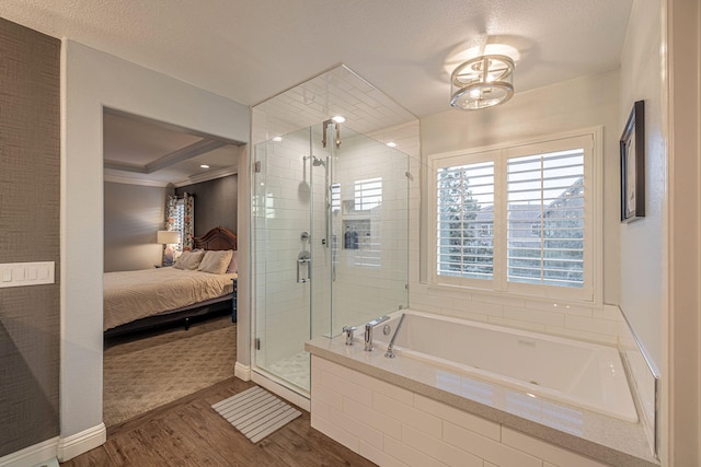 4104 Rainer Pl, Quartz Hill, CA 93536 - full bath featuring wood finished floors, ensuite bath, a stall shower, a bath, and ornamental molding