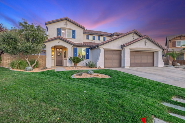 4104 Rainer Pl, Quartz Hill, CA 93536 - mediterranean / spanish house featuring stucco siding, driveway, a garage, a tile roof, and a front yard