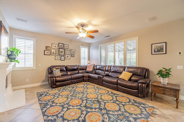 4104 Rainer Pl, Quartz Hill, CA 93536 - living area with light tile patterned floors, ceiling fan, and baseboards