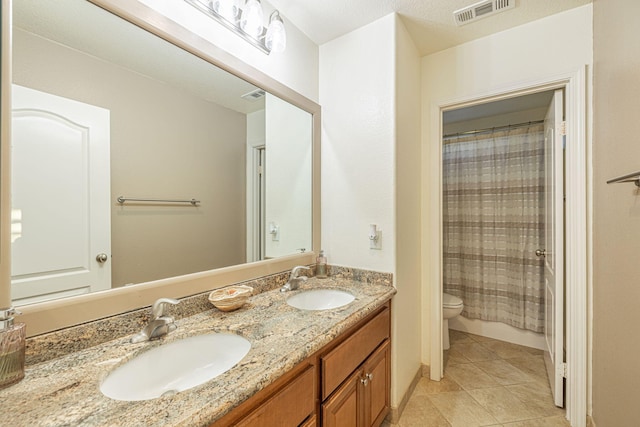 4104 Rainer Pl, Quartz Hill, CA 93536 - bathroom featuring toilet, double vanity, tile patterned flooring, and a shower with curtain
