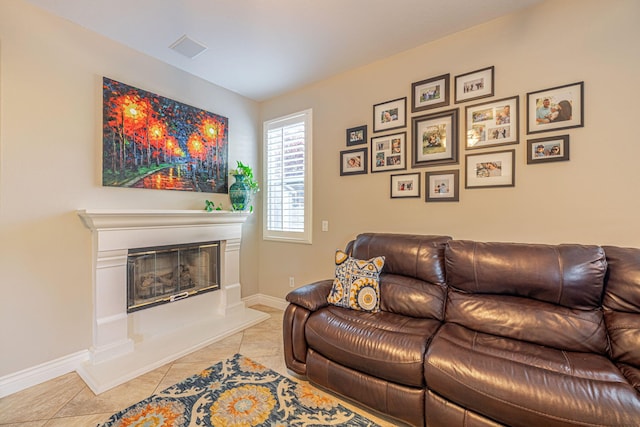 4104 Rainer Pl, Quartz Hill, CA 93536 - living room with light tile patterned flooring, a glass covered fireplace, and baseboards
