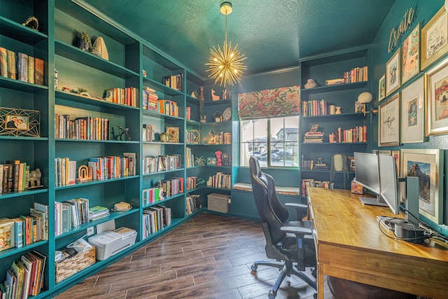 4104 Rainer Pl, Quartz Hill, CA 93536 - office area with wood finished floors, a textured ceiling, and bookshelves