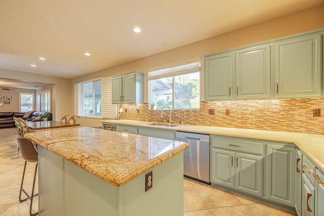 4104 Rainer Pl, Quartz Hill, CA 93536 - kitchen featuring stainless steel dishwasher, a sink, light tile patterned floors, recessed lighting, and a kitchen island