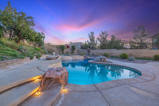 4104 Rainer Pl, Quartz Hill, CA 93536 - pool at dusk featuring a fenced backyard, a patio, and a pool with connected hot tub