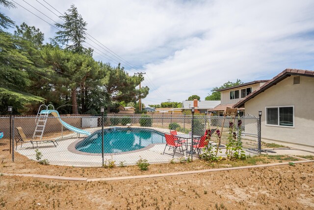 43818 Halcom Ave, Lancaster, CA 93536 - view of swimming pool with a water slide and a patio area