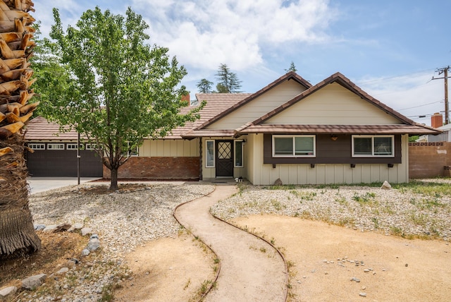 43818 Halcom Ave, Lancaster, CA 93536 - view of front of property with a garage, concrete driveway, a chimney, and brick siding