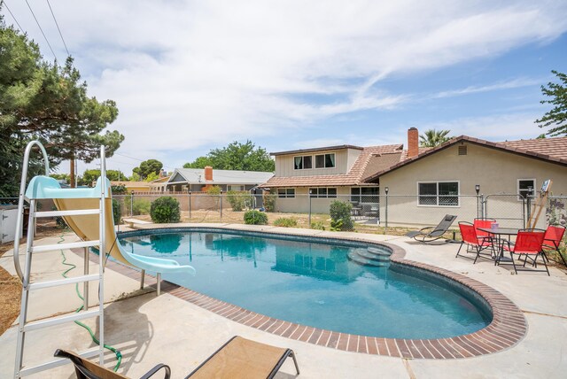 43818 Halcom Ave, Lancaster, CA 93536 - view of pool featuring a water slide and a patio area