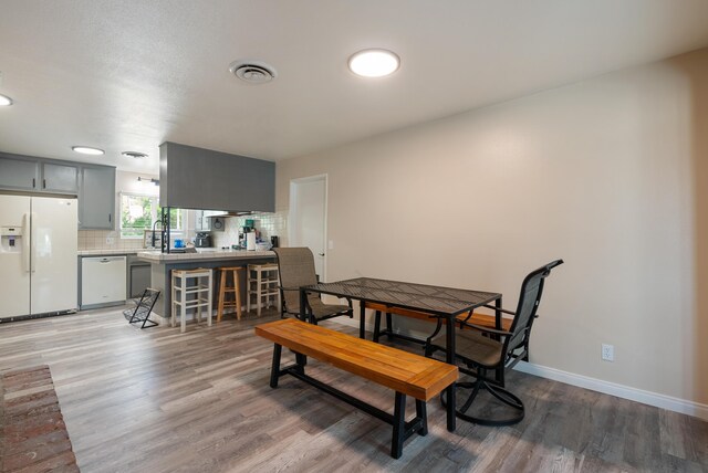 43818 Halcom Ave, Lancaster, CA 93536 - dining area featuring light wood-style floors and baseboards