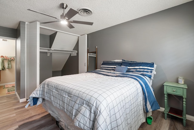 43818 Halcom Ave, Lancaster, CA 93536 - bedroom featuring wood finished floors, baseboards, ceiling fan, a textured ceiling, and a closet