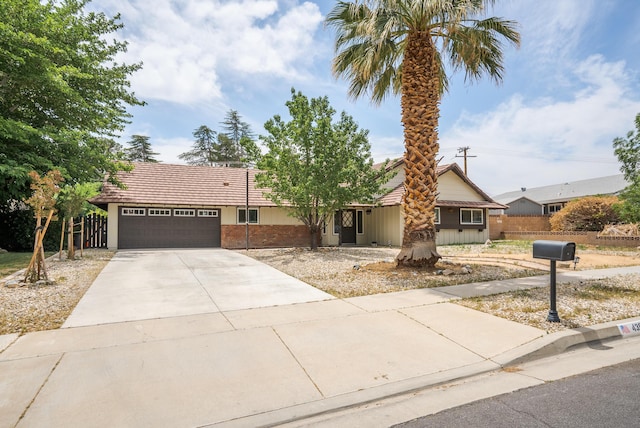 43818 Halcom Ave, Lancaster, CA 93536 - ranch-style house featuring an attached garage, driveway, and a tiled roof