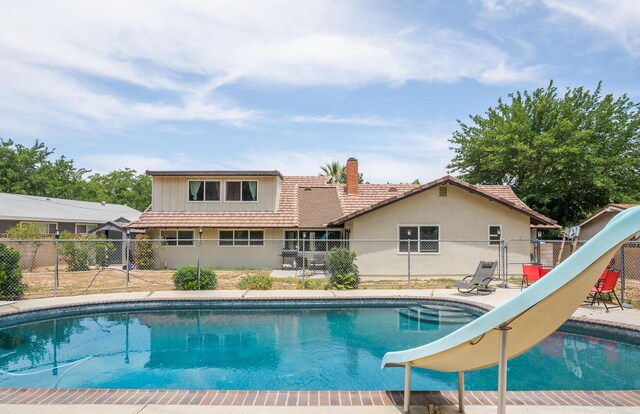 43818 Halcom Ave, Lancaster, CA 93536 - view of pool featuring a water slide and a gate