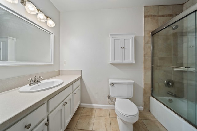 full bathroom with toilet, shower / bath combination with glass door, vanity, and tile patterned floors