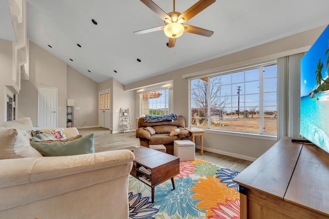 living room with a ceiling fan, baseboards, light wood finished floors, and high vaulted ceiling