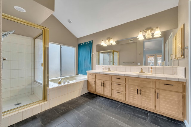 full bath featuring a sink, lofted ceiling, a garden tub, and a shower stall