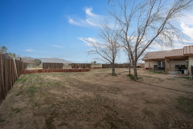 view of yard featuring a patio and a fenced backyard