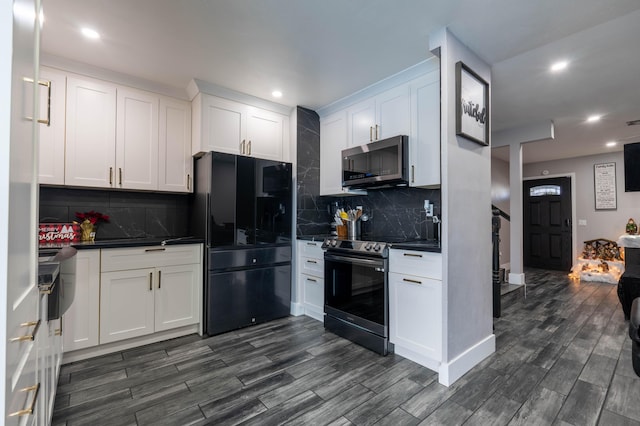 kitchen with decorative backsplash, stainless steel appliances, and white cabinetry