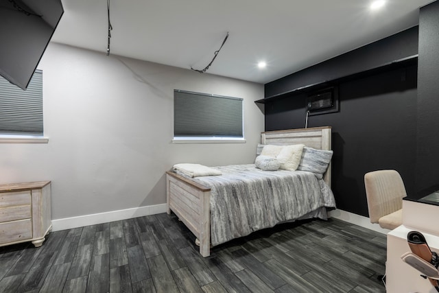 bedroom with dark hardwood / wood-style flooring