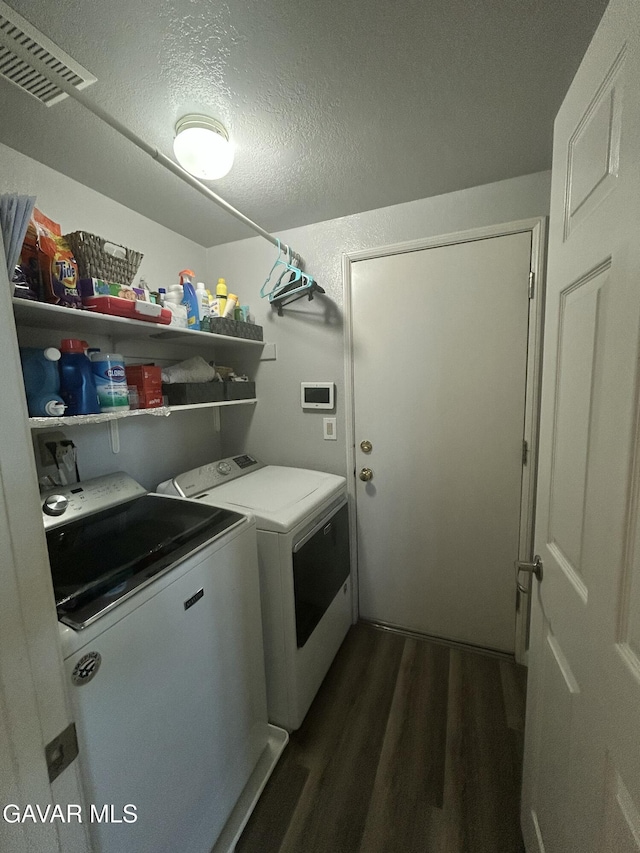 38836 Calistoga St, Palmdale, CA 93551 - laundry room with separate washer and dryer, dark wood-style flooring, and a textured ceiling