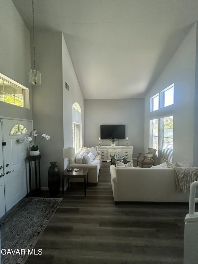 38836 Calistoga St, Palmdale, CA 93551 - living area with high vaulted ceiling, dark wood finished floors, and a chandelier
