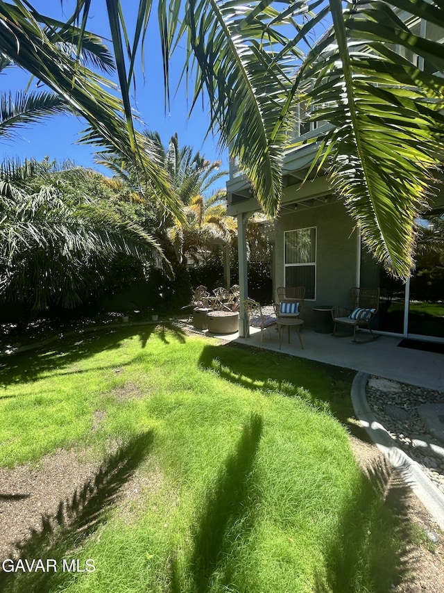 38836 Calistoga St, Palmdale, CA 93551 - view of green lawn with a patio area