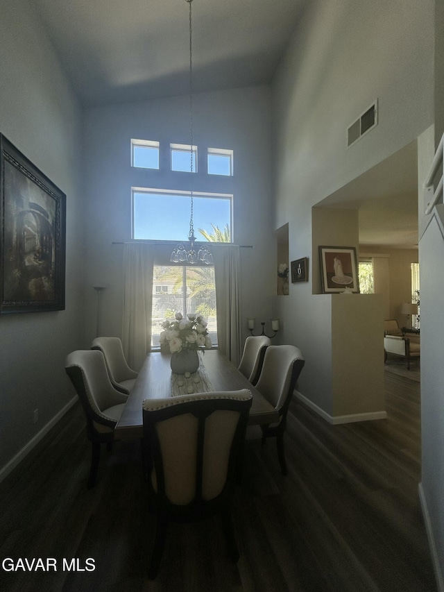 38836 Calistoga St, Palmdale, CA 93551 - dining room featuring a towering ceiling, dark wood-type flooring, and plenty of natural light