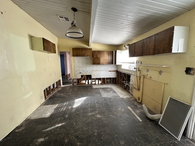 kitchen with wood ceiling, visible vents, and dark brown cabinets