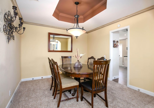3215 Larwood Dr, Lancaster, CA 93536 - carpeted dining room with crown molding, a raised ceiling, and baseboards