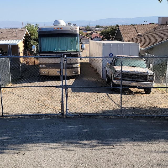 exterior space with fence and a mountain view