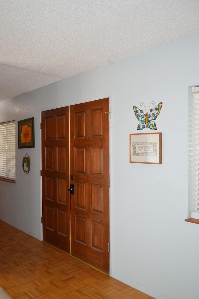 foyer featuring a textured ceiling