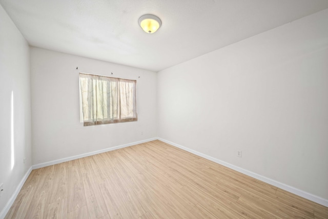 empty room with light wood-type flooring