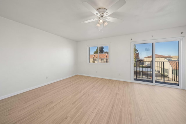 spare room with ceiling fan and light hardwood / wood-style floors