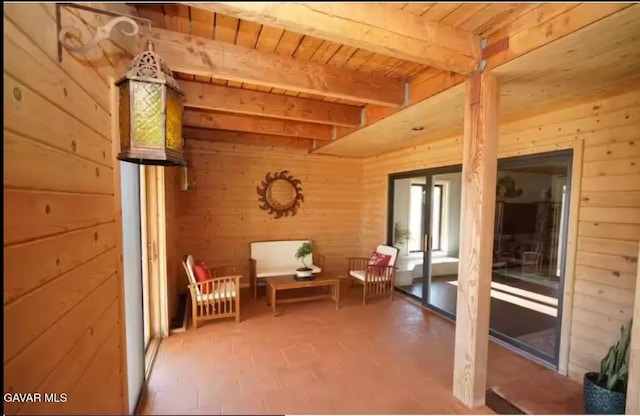 30508 Buckskin Dr, Tehachapi, CA 93561 - sitting room featuring wood walls and a wood ceiling with exposed beams