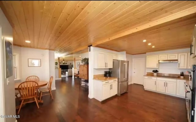 30508 Buckskin Dr, Tehachapi, CA 93561 - kitchen with wooden ceiling, freestanding refrigerator, dark wood-type flooring, white cabinetry, and black electric cooktop