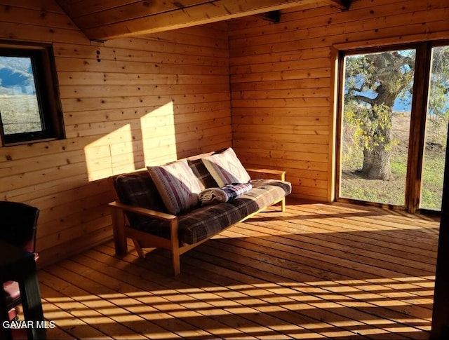 30508 Buckskin Dr, Tehachapi, CA 93561 - sitting room featuring wood-type flooring, wood walls, and vaulted ceiling