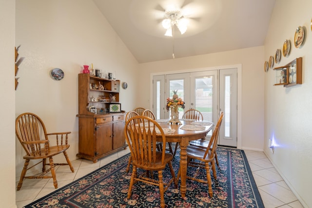 dining area with light tile patterned floors, french doors, vaulted ceiling, and ceiling fan