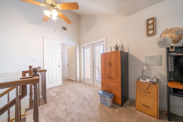 interior space with ceiling fan, french doors, and lofted ceiling