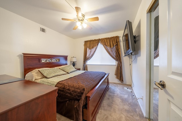 bedroom featuring light carpet and ceiling fan